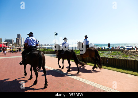 Horseback Metro` police officers on patrol along Durban's beachfront. Stock Photo